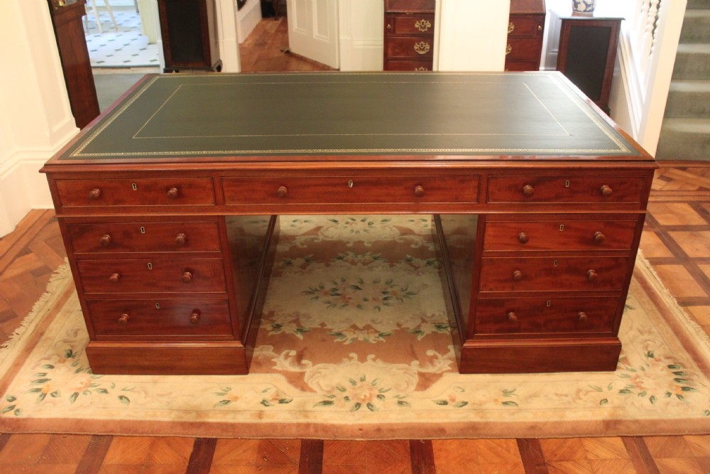 A fine George IV early 19th century 18 drawer mahogany partners desk