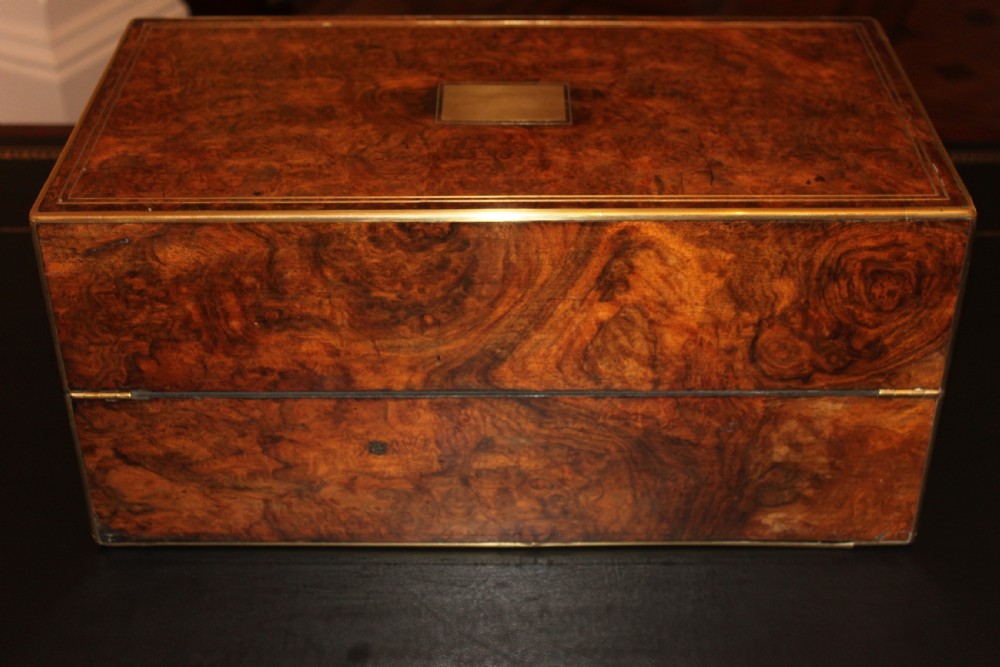 A 19th. century top quality burr walnut and brass inlaid writing slope. View II