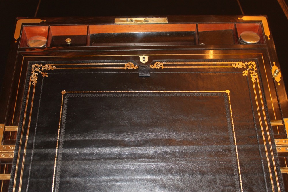 A 19th. century top quality burr walnut and brass inlaid writing slope. View VI