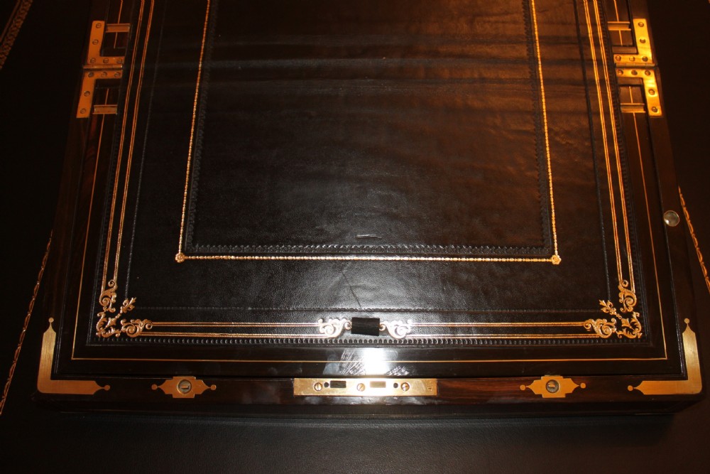 A 19th. century top quality burr walnut and brass inlaid writing slope. View VII