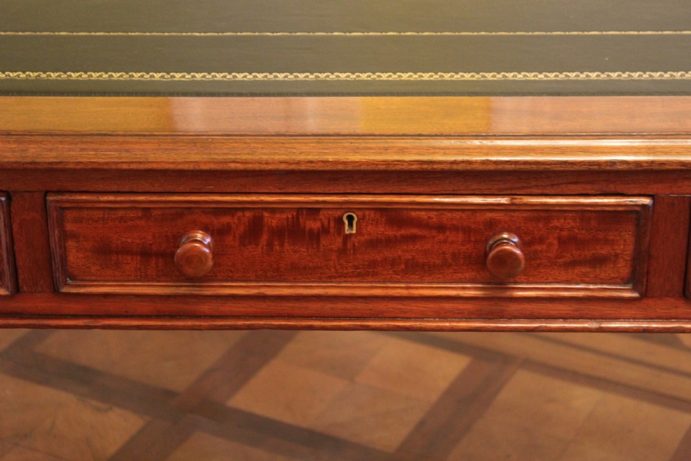 An early 19th century light mahogany six drawer partners library table View III
