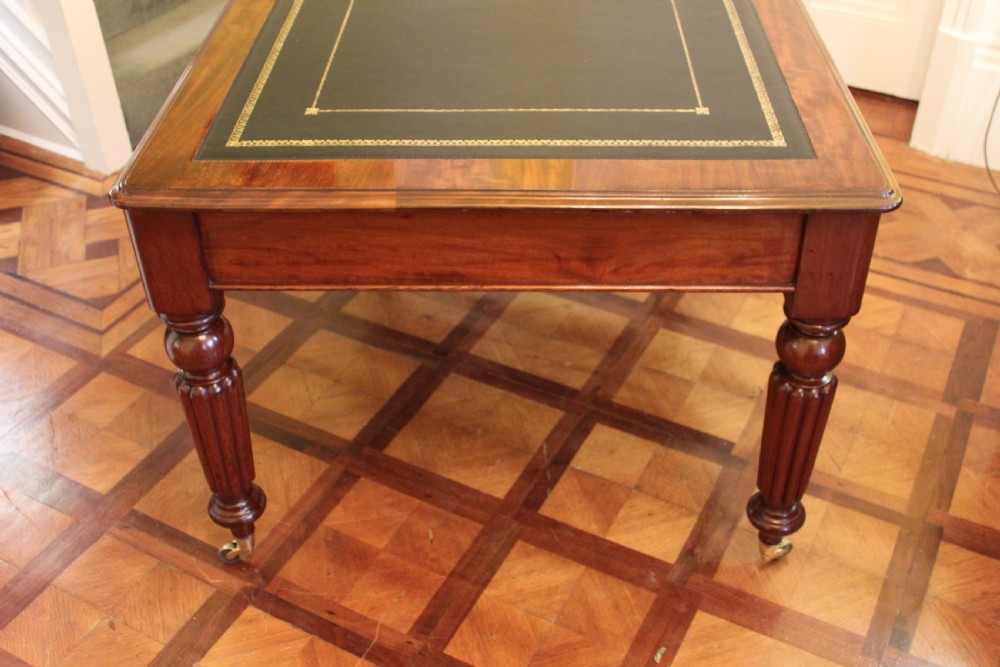 An early 19th century light mahogany six drawer partners library table View V