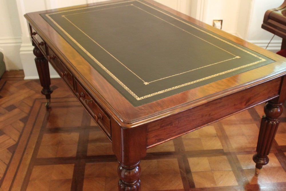 An early 19th century light mahogany six drawer partners library table View VII