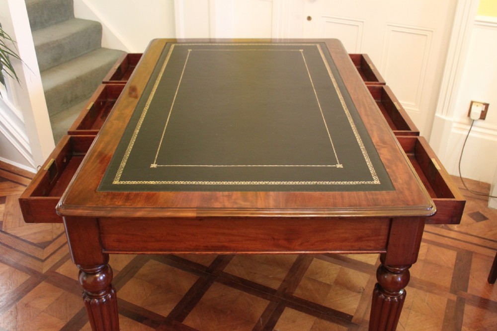 An early 19th century light mahogany six drawer partners library table View VIII