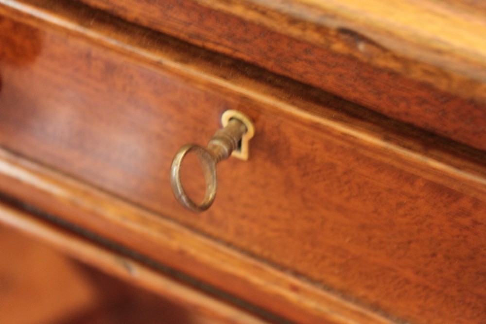 An early 19th century light mahogany six drawer partners library table View XI