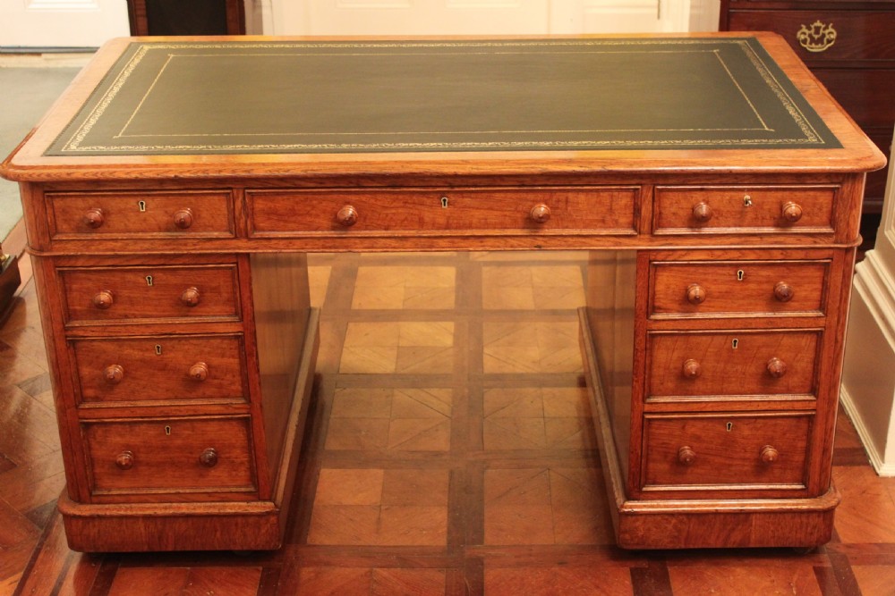 A fine quality oak pedestal desk by Edwards & Roberts
