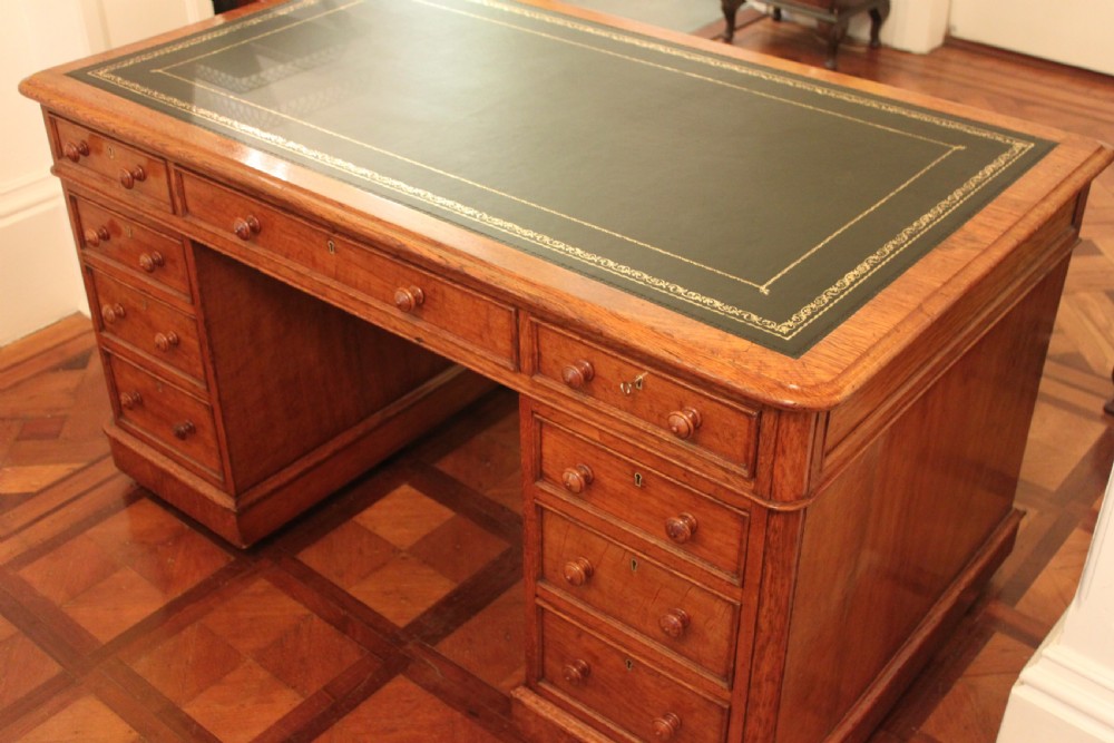 A fine quality oak pedestal desk by Edwards & Roberts View IV