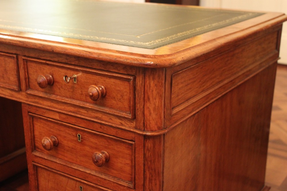 A fine quality oak pedestal desk by Edwards & Roberts View V