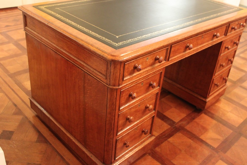 A fine quality oak pedestal desk by Edwards & Roberts View VI