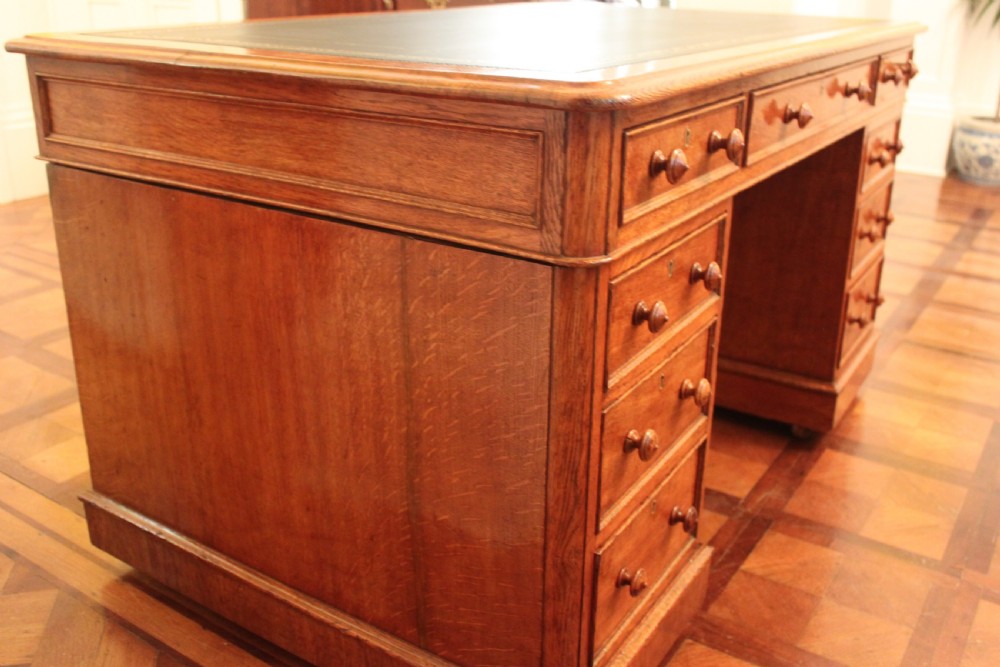 A fine quality oak pedestal desk by Edwards & Roberts View VII