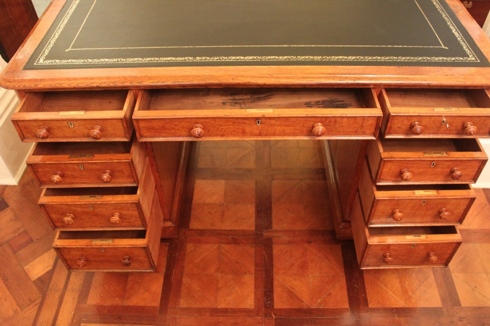 A fine quality oak pedestal desk by Edwards & Roberts View VIII