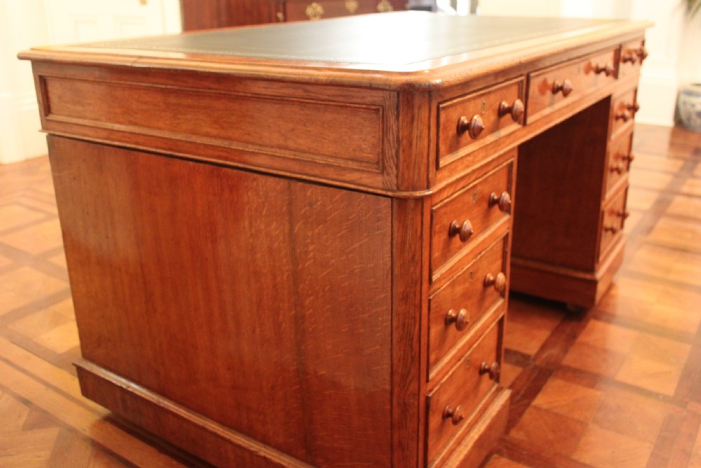 A fine quality oak pedestal desk by Edwards & Roberts View XV