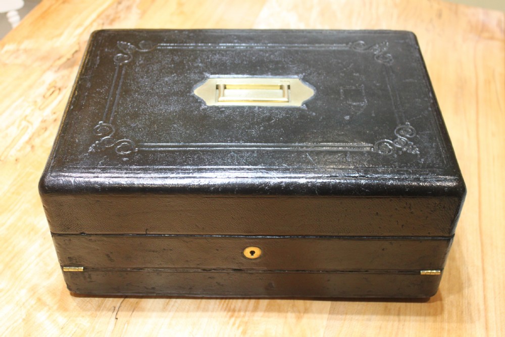 A rare black leather bound writing slope by J Fryer, Charing Cross, London.