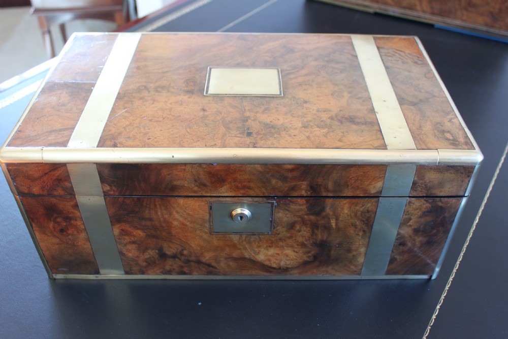 A fine Victorian burr walnut and brass bound writing slope.