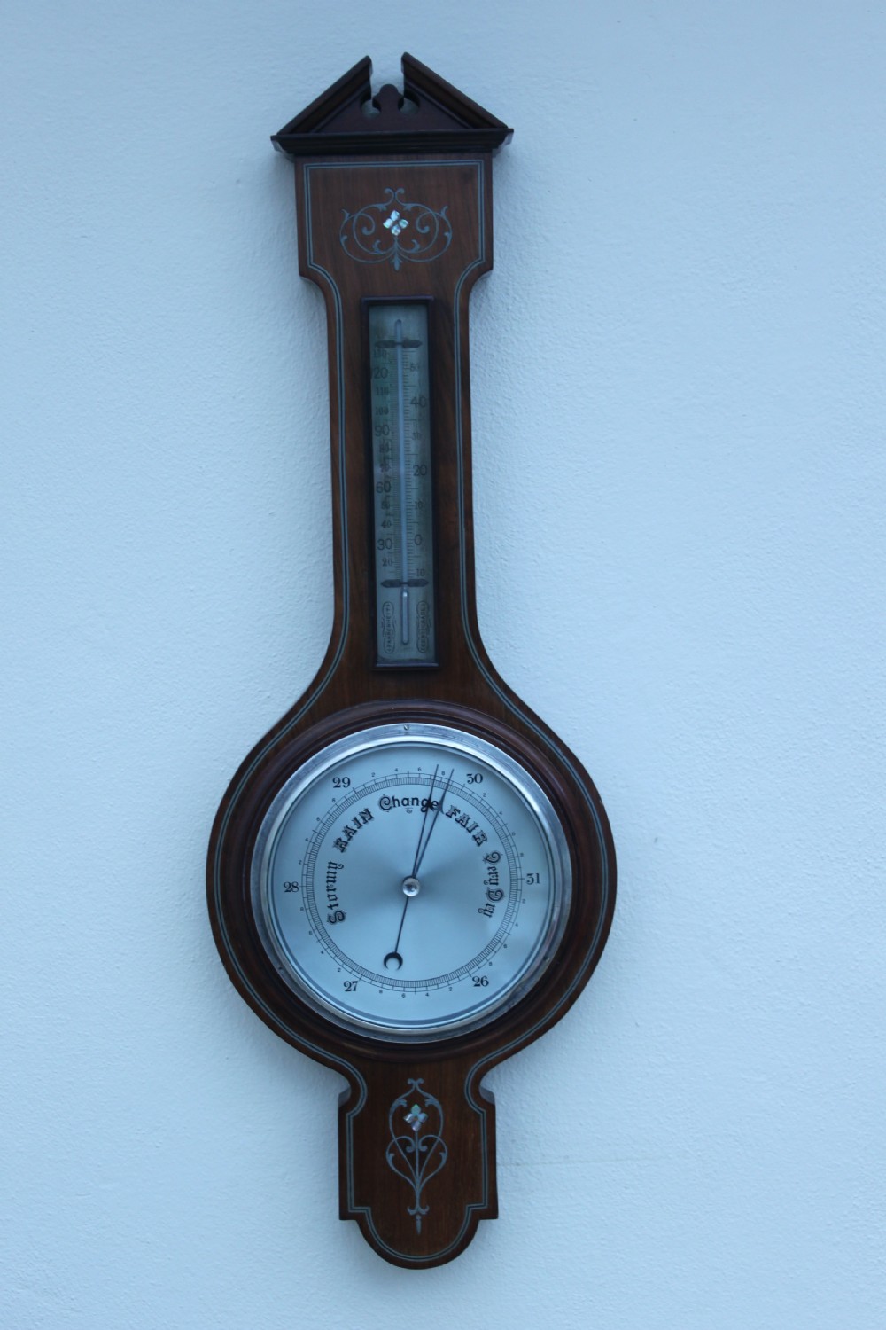 An early 20th century inlaid mahogany aneroid barometer View II