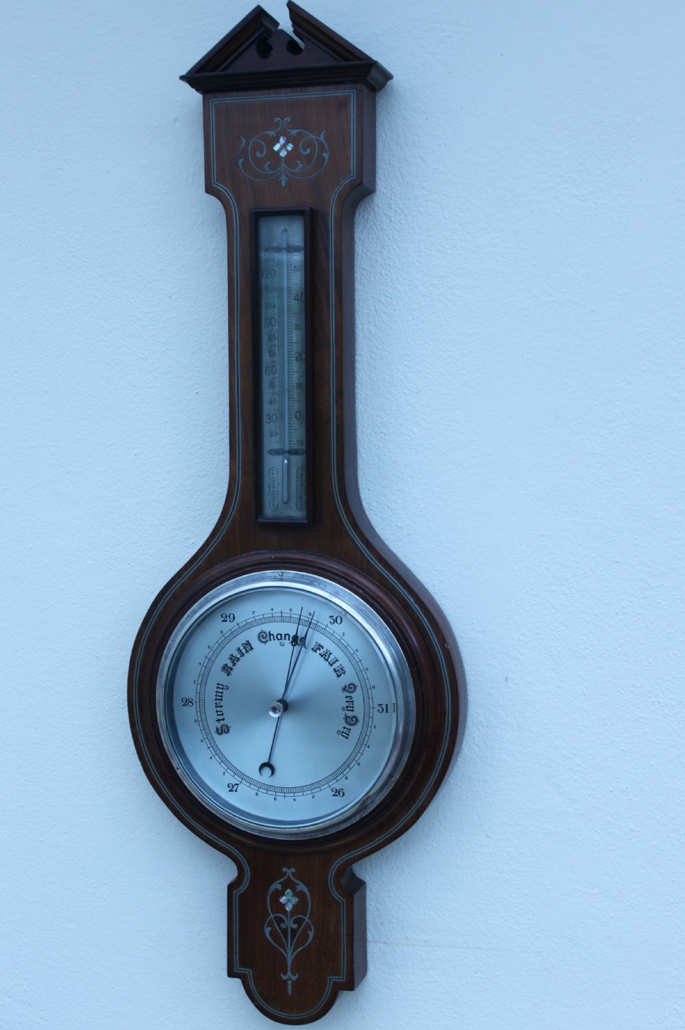 An early 20th century inlaid mahogany aneroid barometer View III