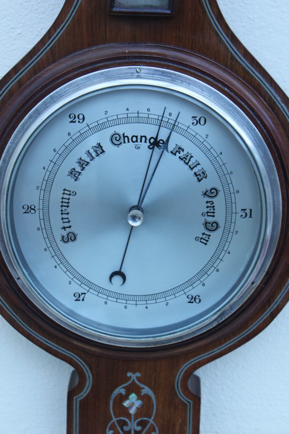 An early 20th century inlaid mahogany aneroid barometer View IV