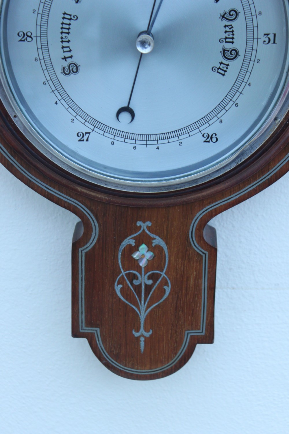 An early 20th century inlaid mahogany aneroid barometer View V