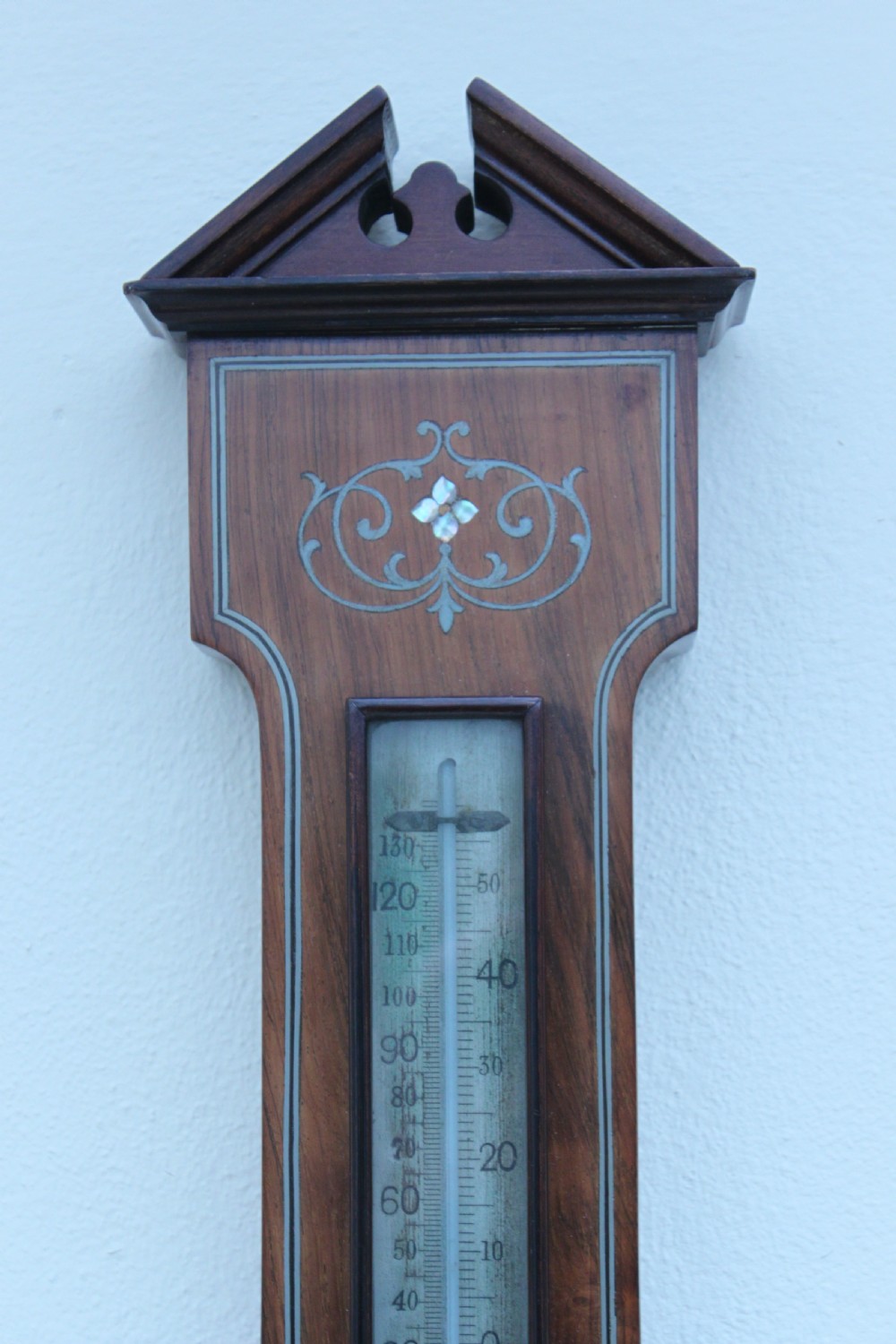 An early 20th century inlaid mahogany aneroid barometer View VI