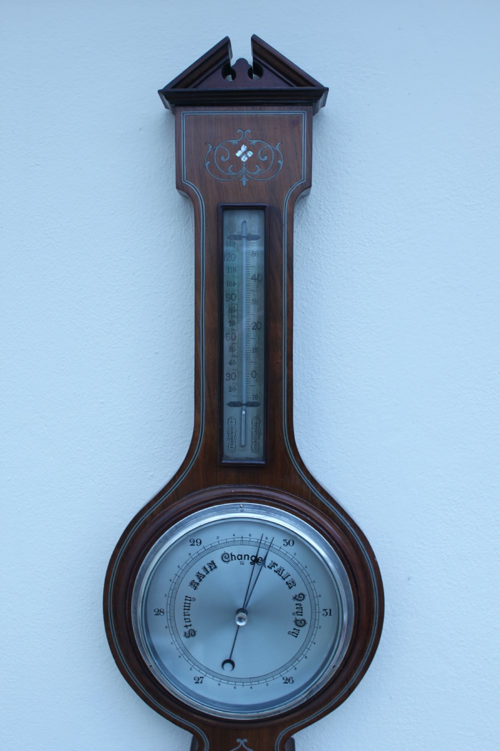 An early 20th century inlaid mahogany aneroid barometer View VII
