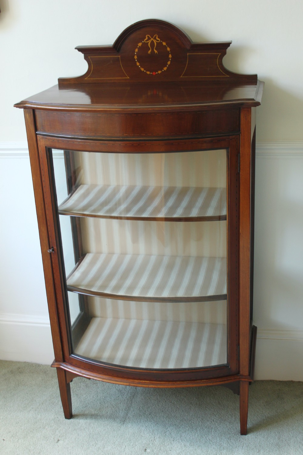 Edwardian mahogany and inlaid bow front display cabinet
