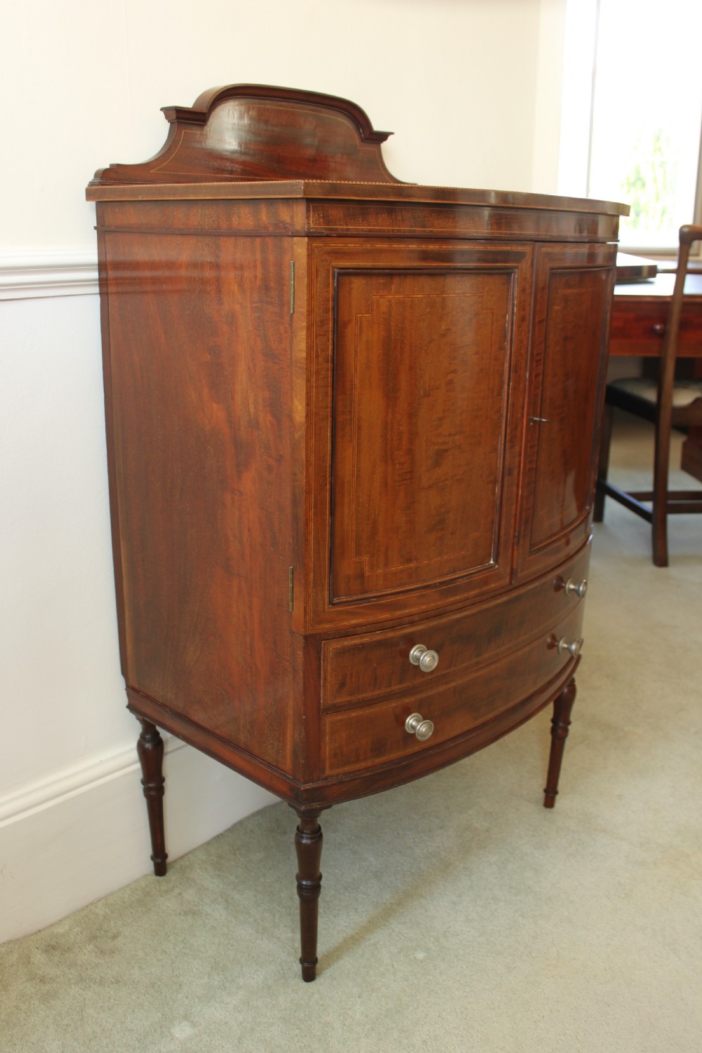 A fine quality Edwardian inlaid bowfront mahogany music cabinet. View III