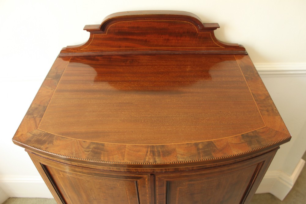 A fine quality Edwardian inlaid bowfront mahogany music cabinet. View IV