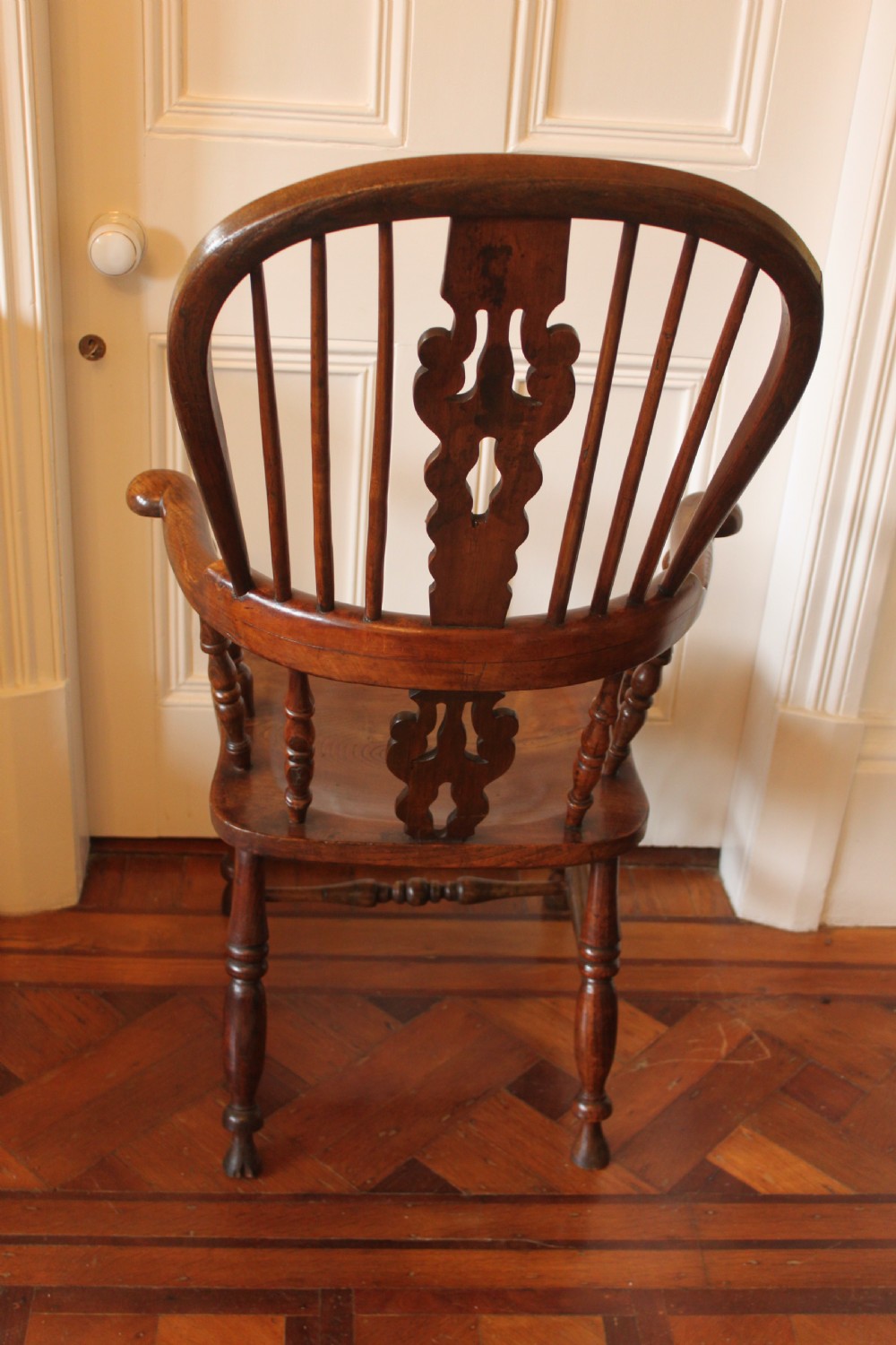 A 19th century north country ash and elm broadarm Windsor armchair. View V