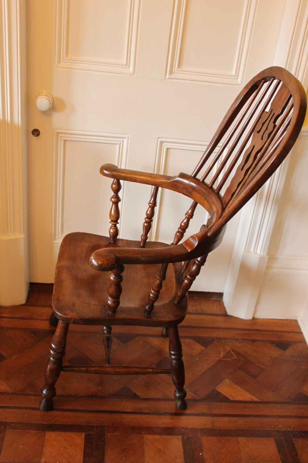 A 19th century north country ash and elm broadarm Windsor armchair. View VI
