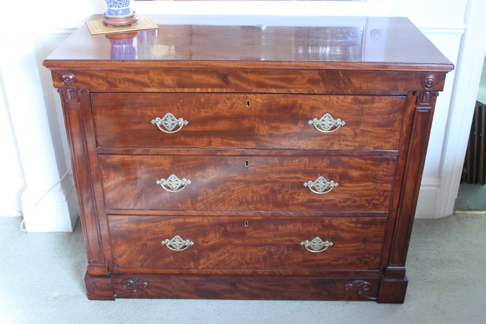 An early 19th century Empire style mahogany chest of drawers