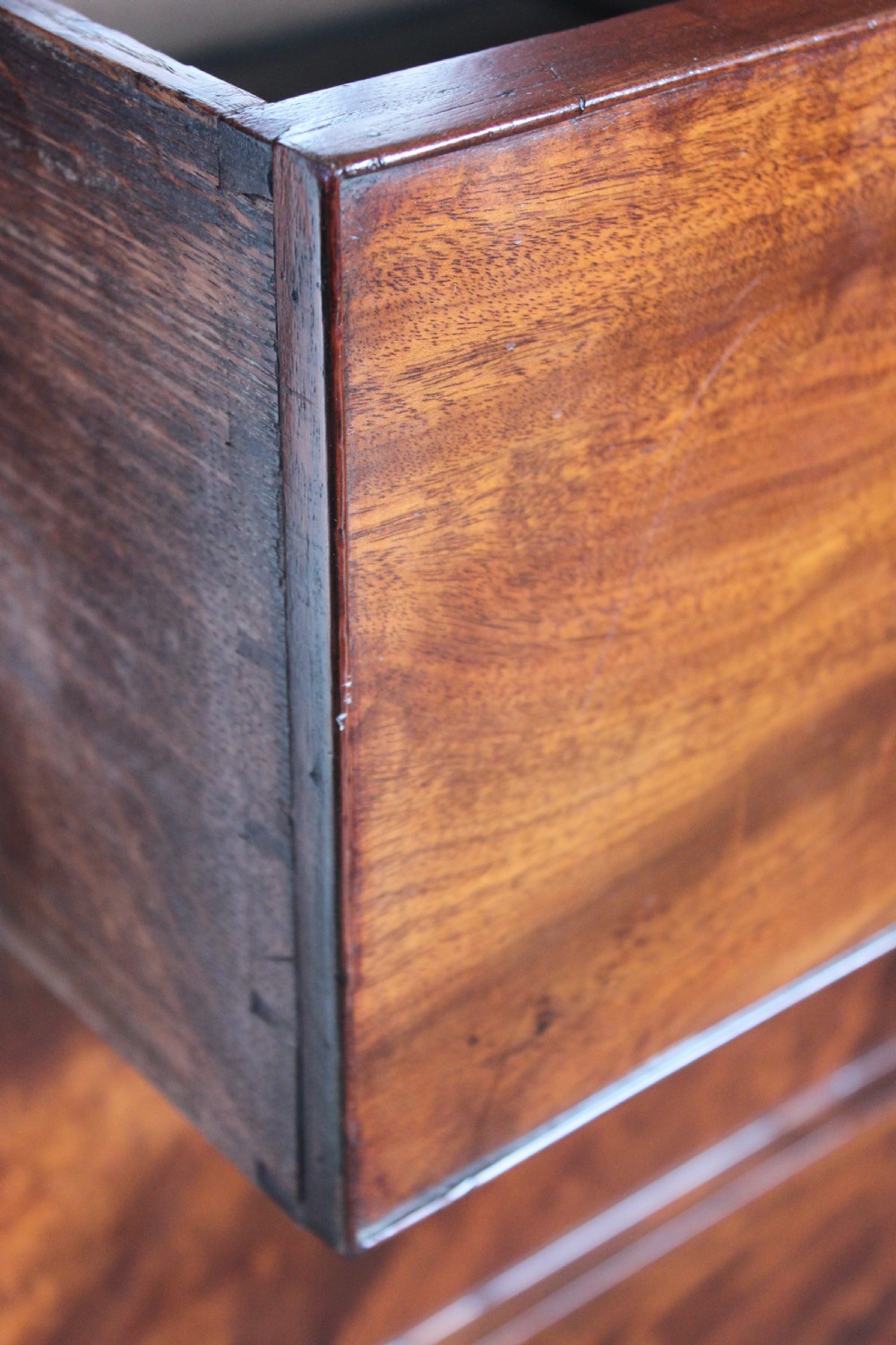 An early 19th century Empire style mahogany chest of drawers View IV