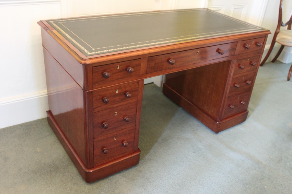A good quality Victorian mahogany 9-drawer pedestal desk View III