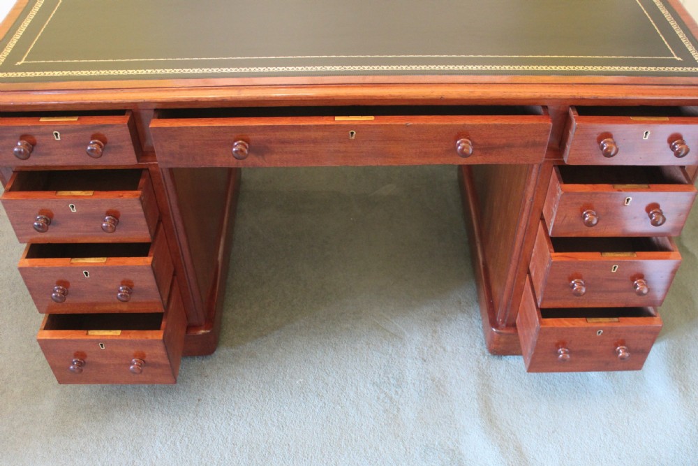 A good quality Victorian mahogany 9-drawer pedestal desk View X