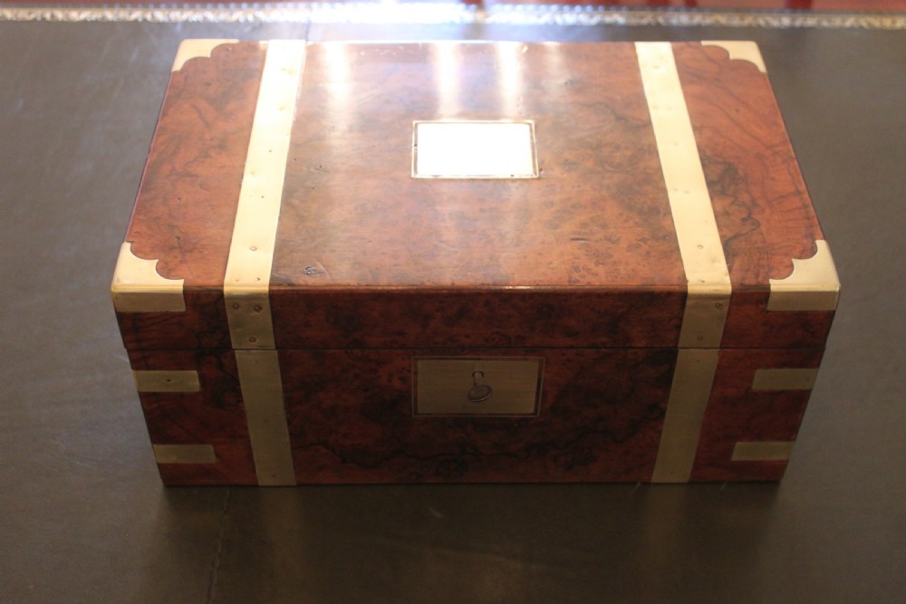 A fine Victorian burr walnut and brass bound writing slope. 