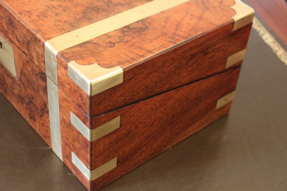 A fine Victorian burr walnut and brass bound writing slope.  View IV