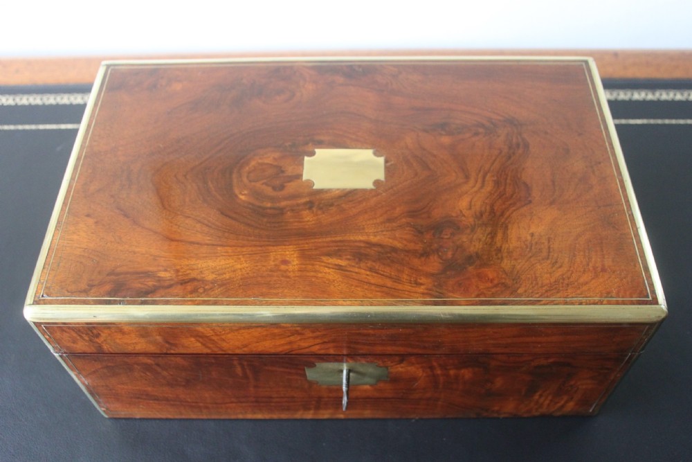 A Victorian figured walnut writing slope with secret drawers. View II