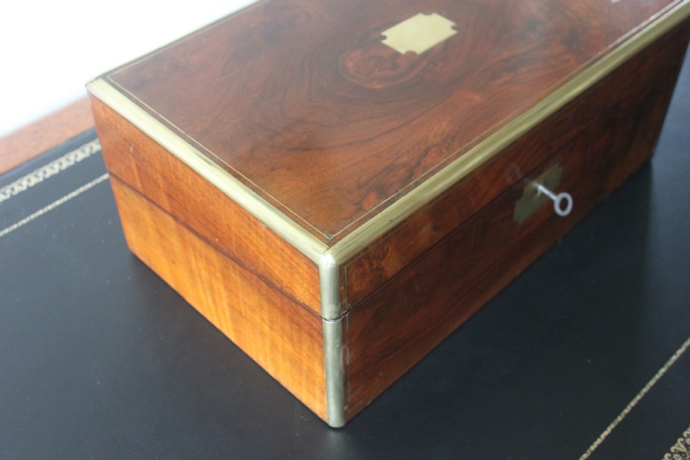 A Victorian figured walnut writing slope with secret drawers. View III