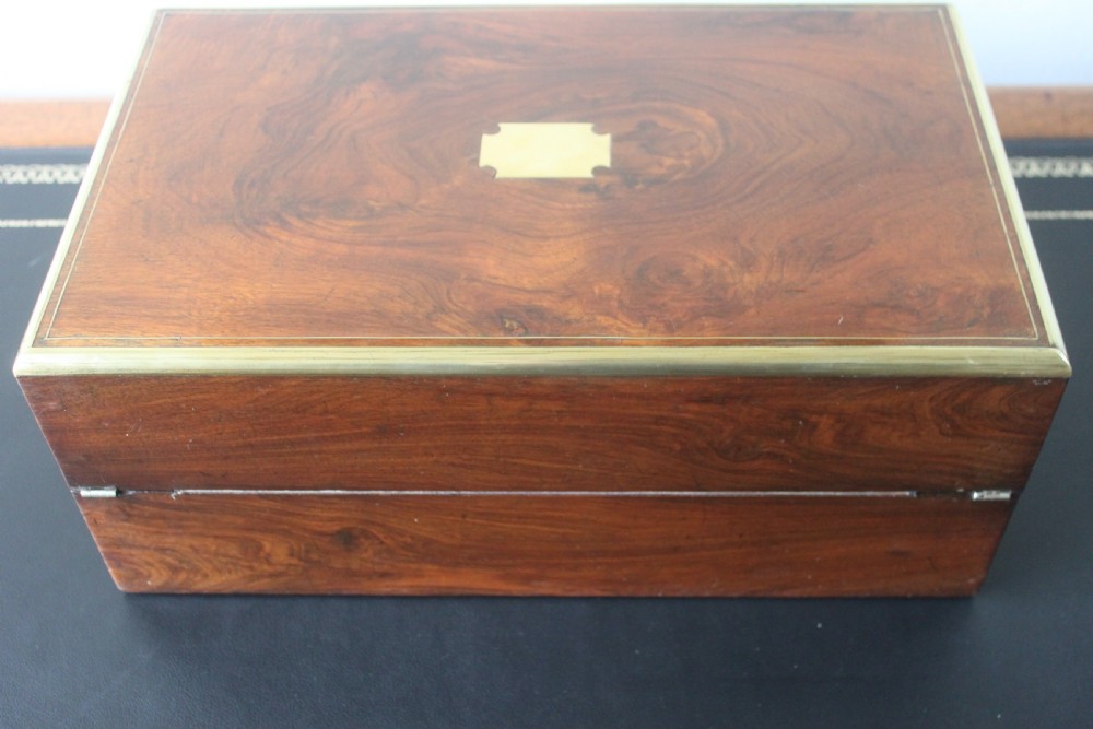 A Victorian figured walnut writing slope with secret drawers. View V