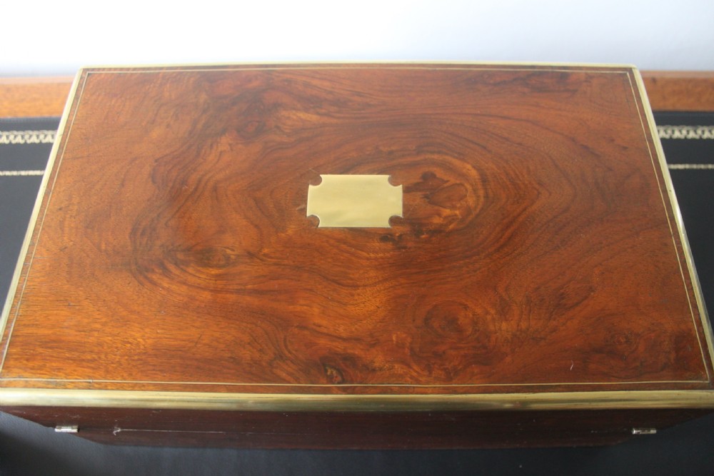 A Victorian figured walnut writing slope with secret drawers. View VI