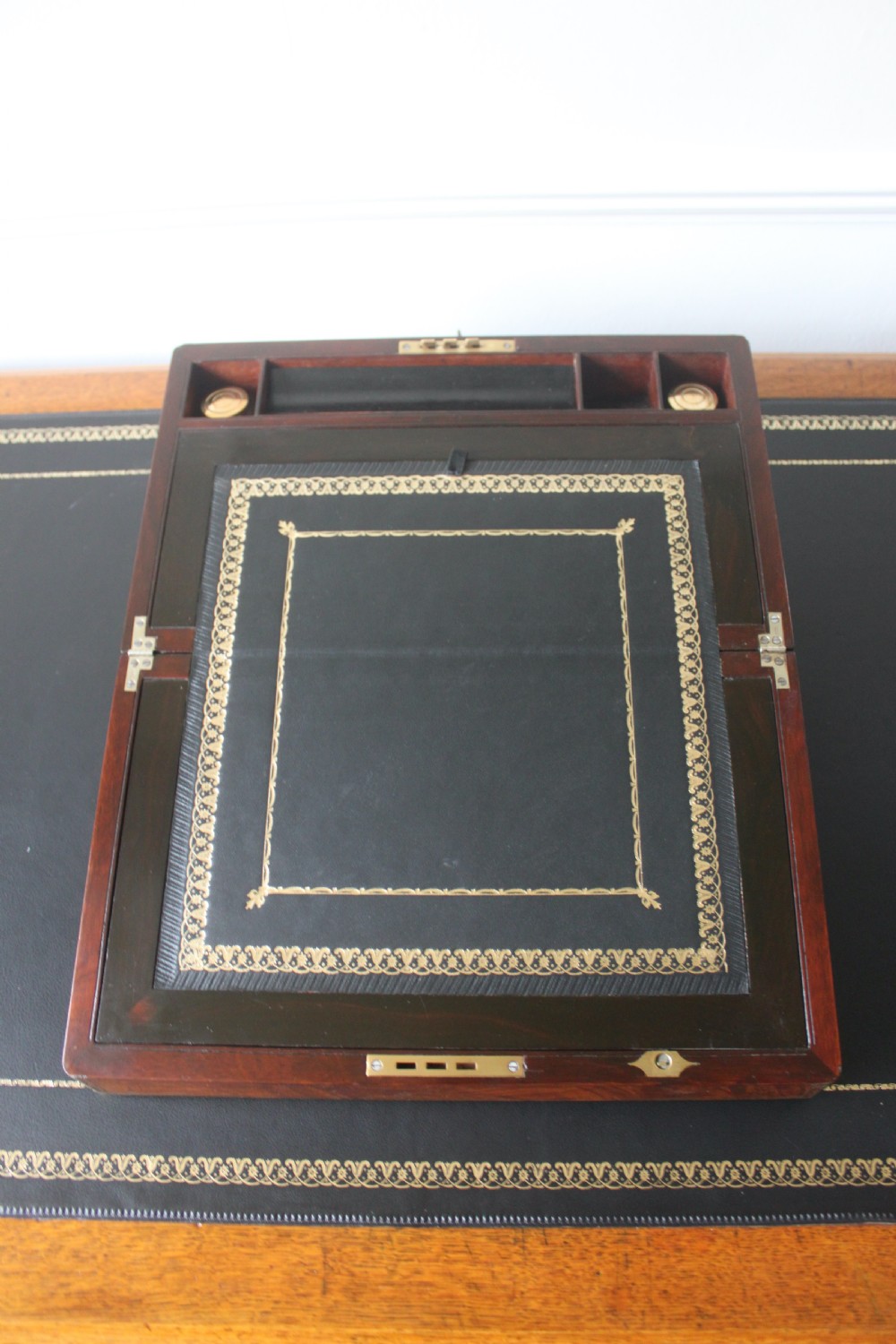 A Victorian figured walnut writing slope with secret drawers. View VII