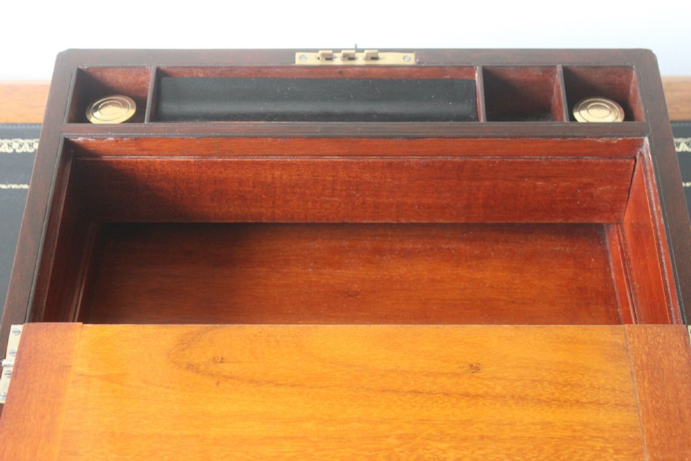A Victorian figured walnut writing slope with secret drawers. View IX