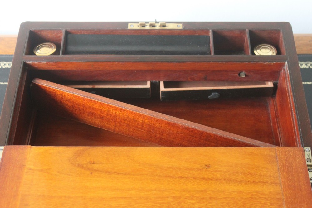 A Victorian figured walnut writing slope with secret drawers. View X