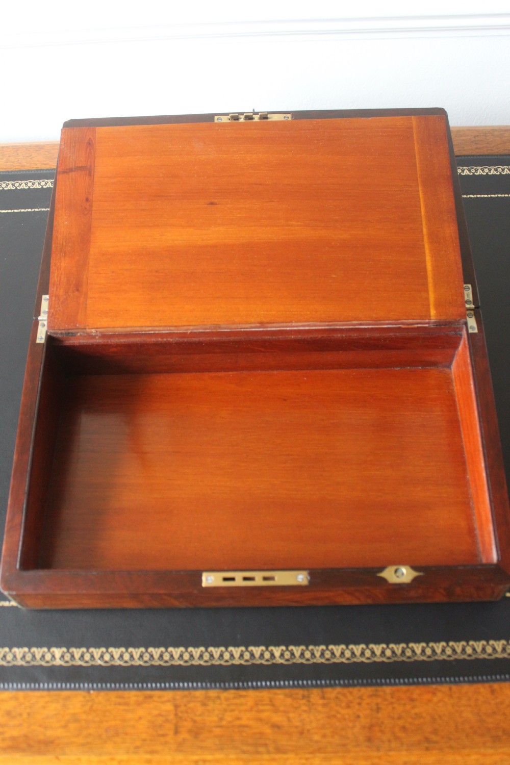 A Victorian figured walnut writing slope with secret drawers. View XI