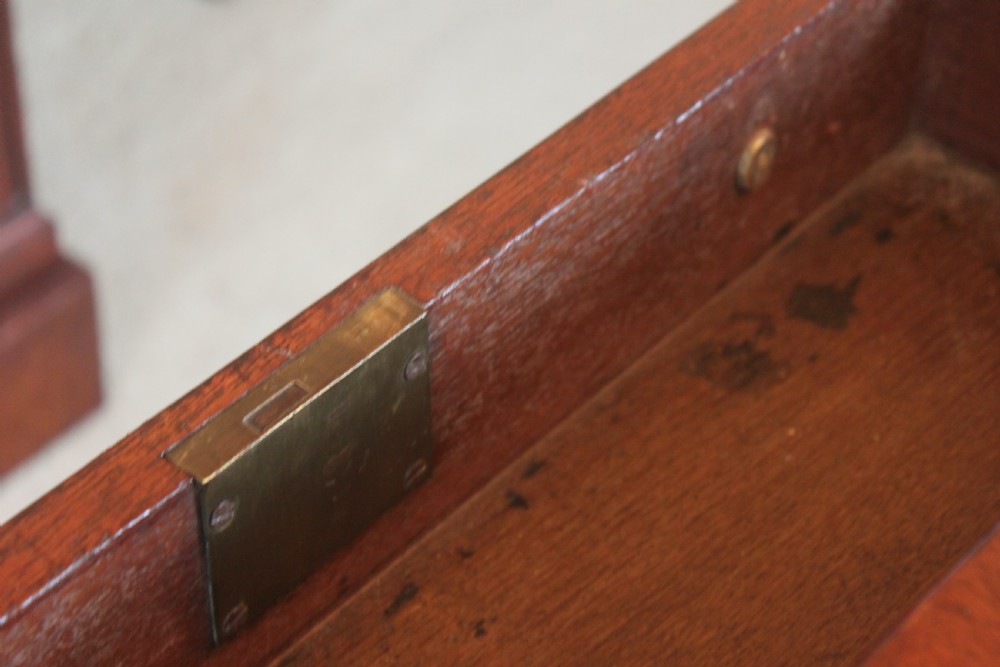A dark mahogany Regency Pembroke table featuring brass line inlay, a single end drawer, drop leaves, and quadform sabre legs with brass cap castors. View VIII