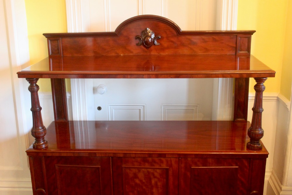 Victorian mahogany buffet sideboard featuring a raised upper tier supported by turned columns above a three-door cupboard base. View III