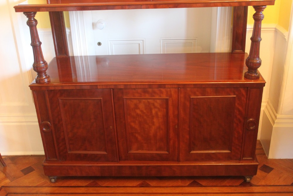Victorian mahogany buffet sideboard featuring a raised upper tier supported by turned columns above a three-door cupboard base. View V
