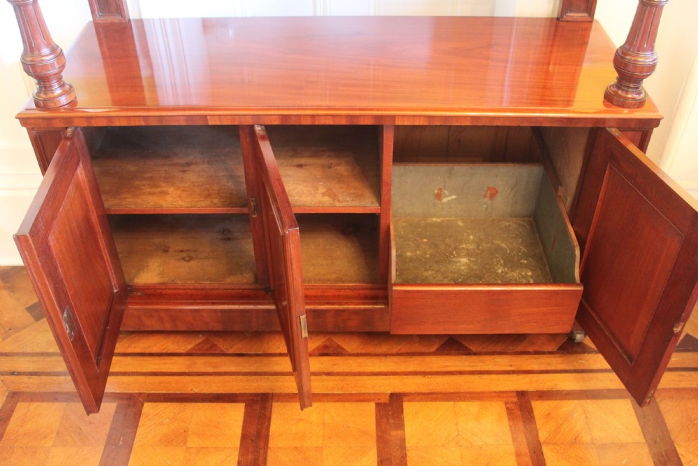Victorian mahogany buffet sideboard featuring a raised upper tier supported by turned columns above a three-door cupboard base. View VII