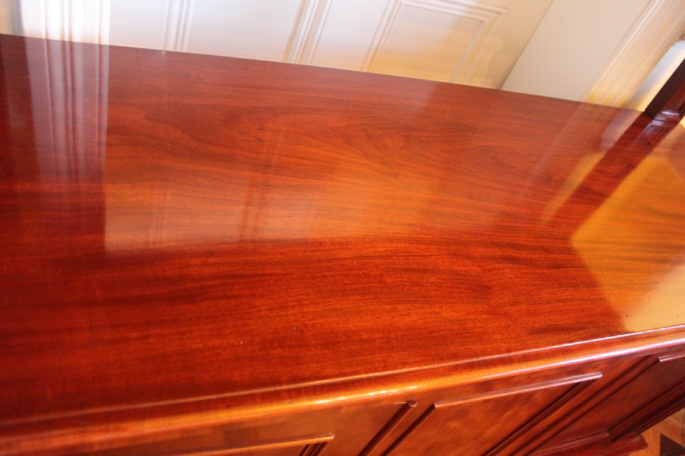 Victorian mahogany buffet sideboard featuring a raised upper tier supported by turned columns above a three-door cupboard base. View X
