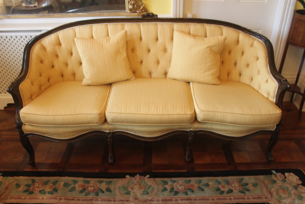 A Victorian walnut Louis XVI style three seater sofa 