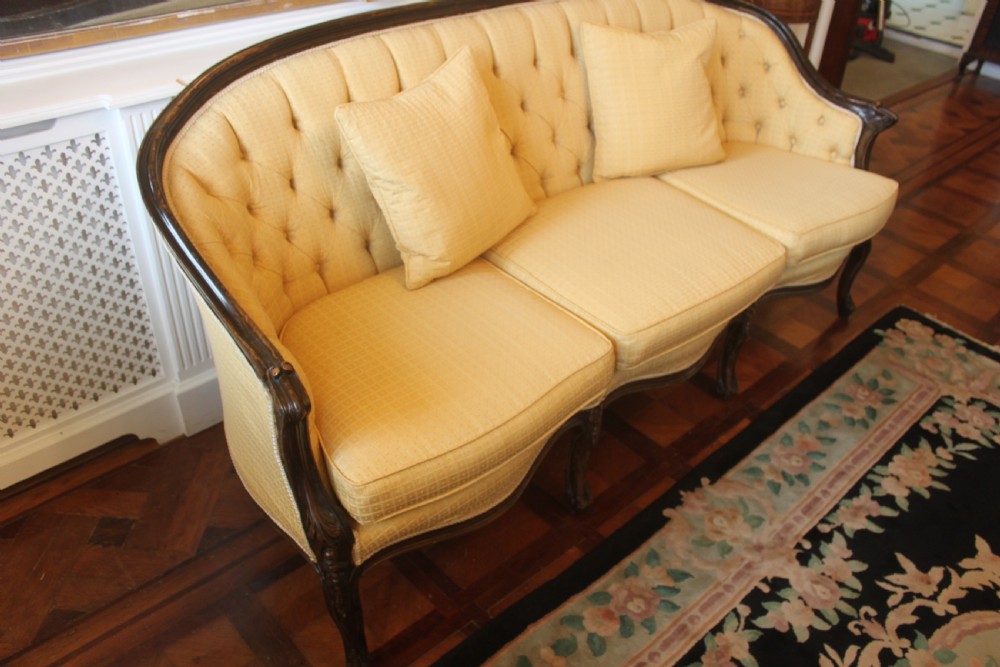 A Victorian walnut Louis XVI style three seater sofa  View II